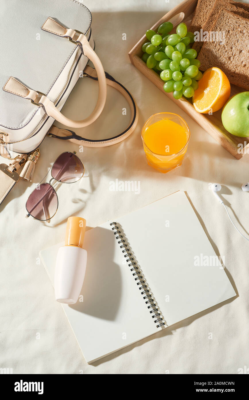Summer holiday with bag, fruit, sun cream, glasses, accessories on white background Stock Photo