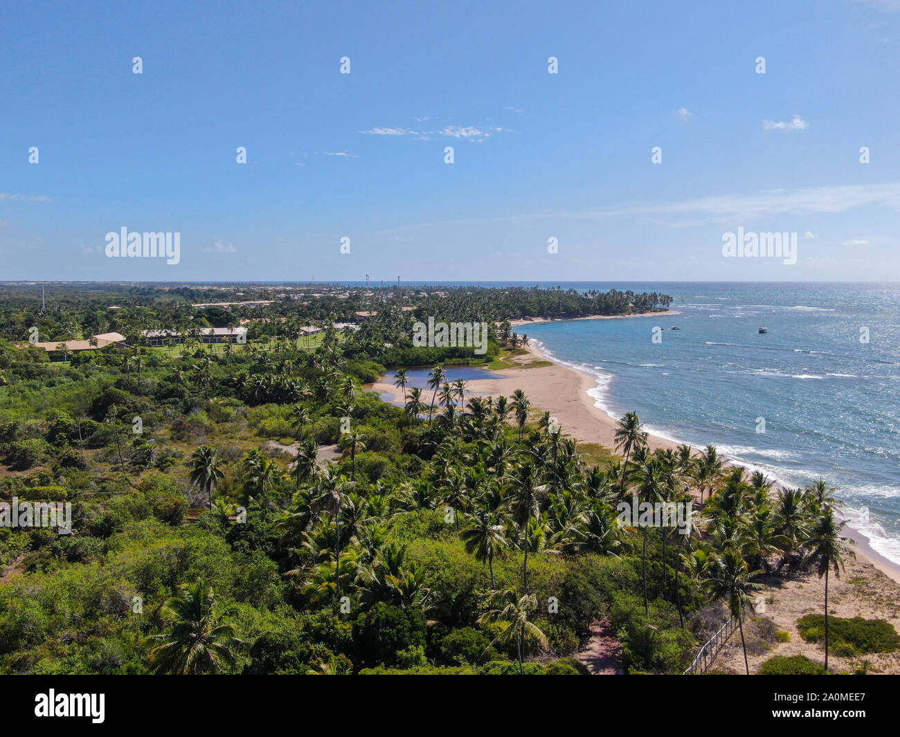 Aerial view of tropical beach and turquoise clear sea water with small ...