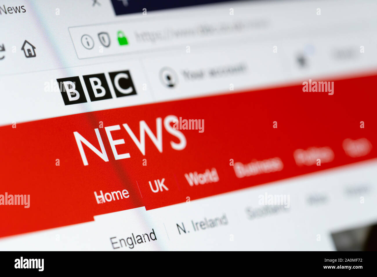 A closeup of a computer screen showing the BBC News website and logo. Concept: fake news, trusted media, woke media, trusted news source Stock Photo