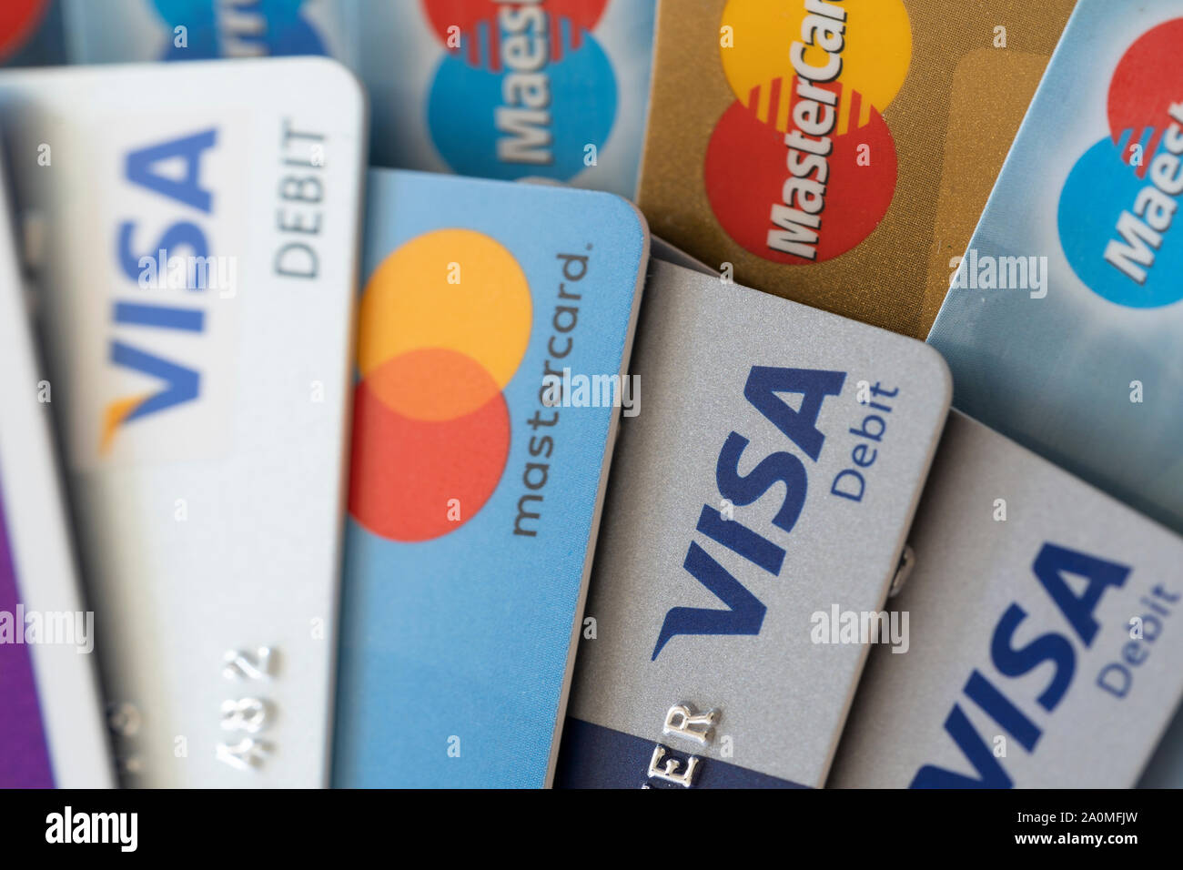 Debit Visa and Mastercard credit cards showing the concepts of finances