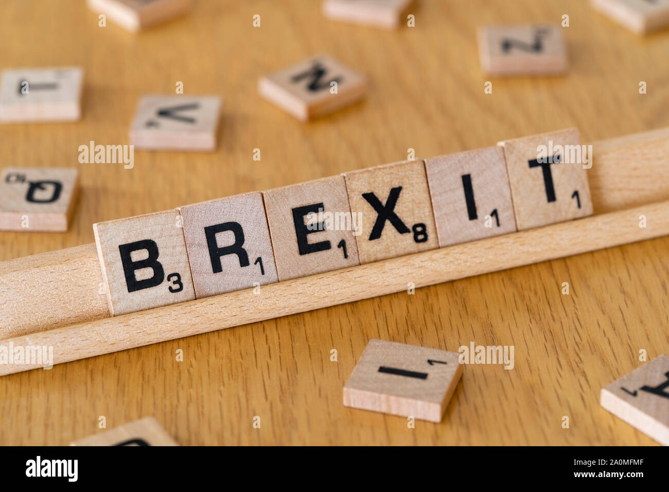 Wooden scrabble letters on a rack spelling out the word Brexit Stock Photo