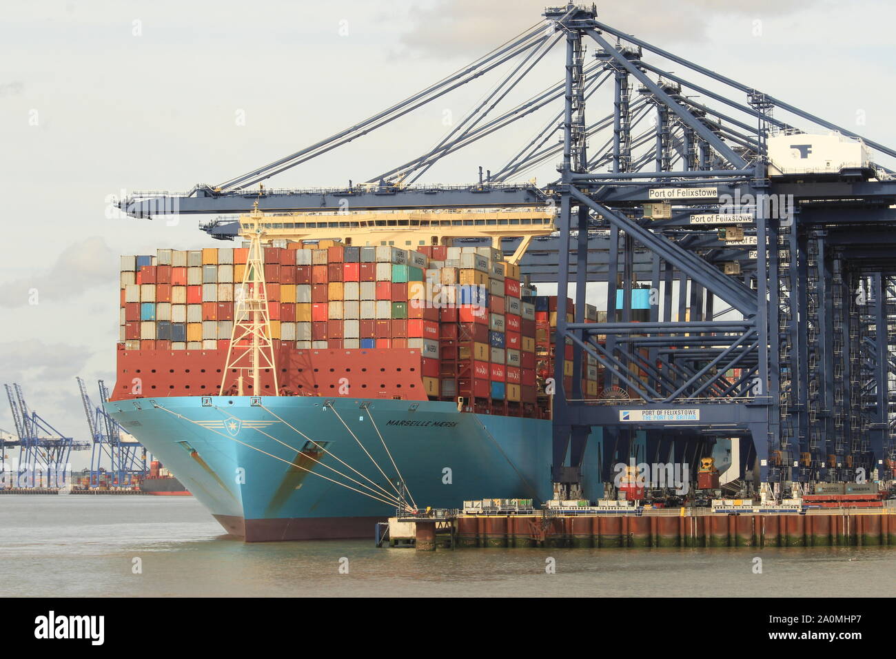 Shipping containers and cargo loaded onto a vessel at the British Port ...