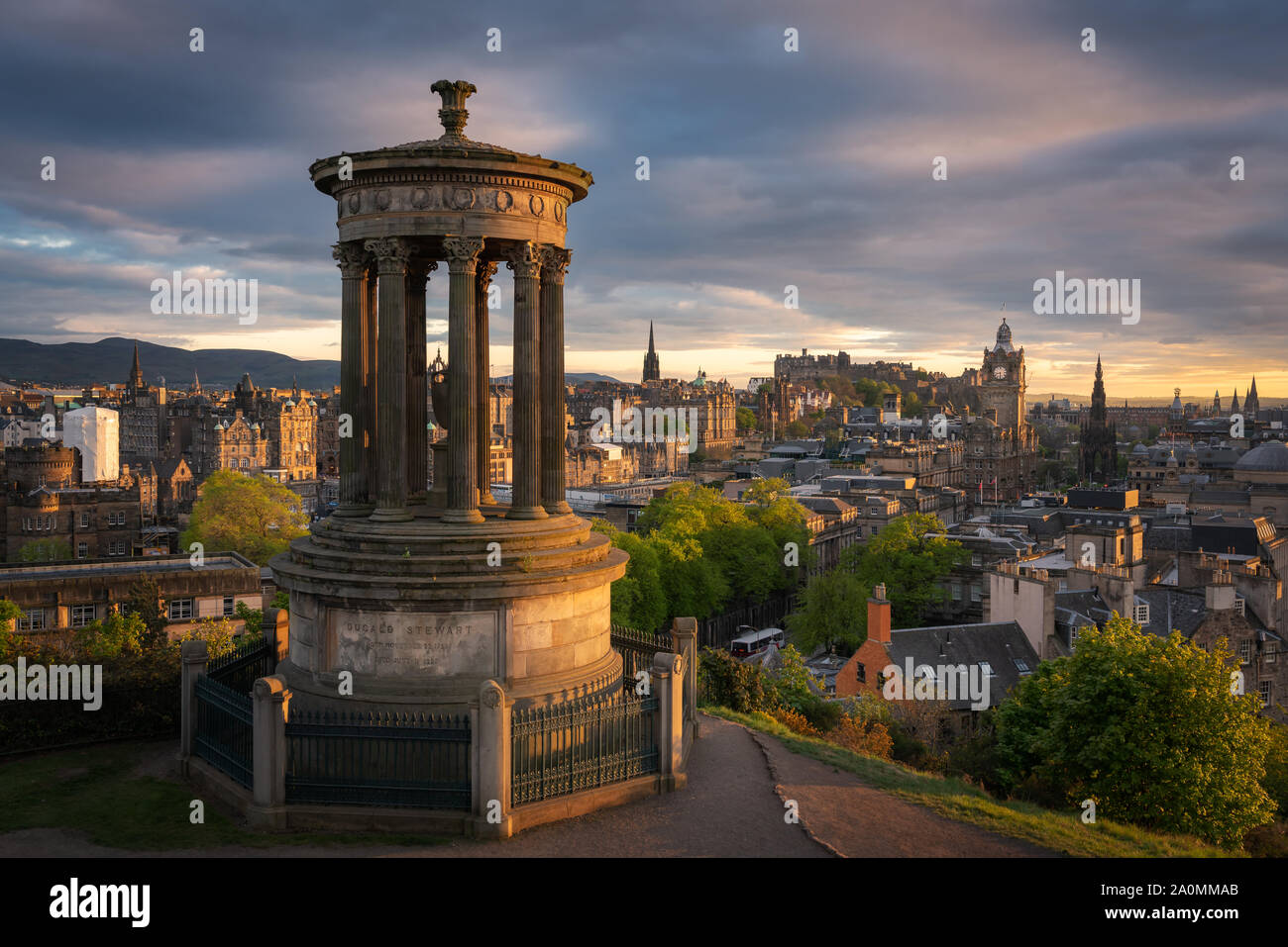 Edinburgh from the top of Calton Hill during a soft and golden sunset Stock Photo