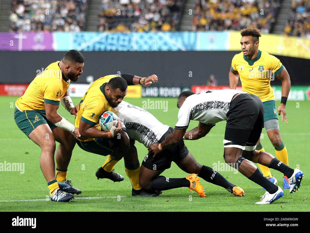 Australia's Samu Kerevi is tackled by Fiji's Levani Botia during the 2019 Rugby World Cup Pool D match at Sapporo Dome. Stock Photo