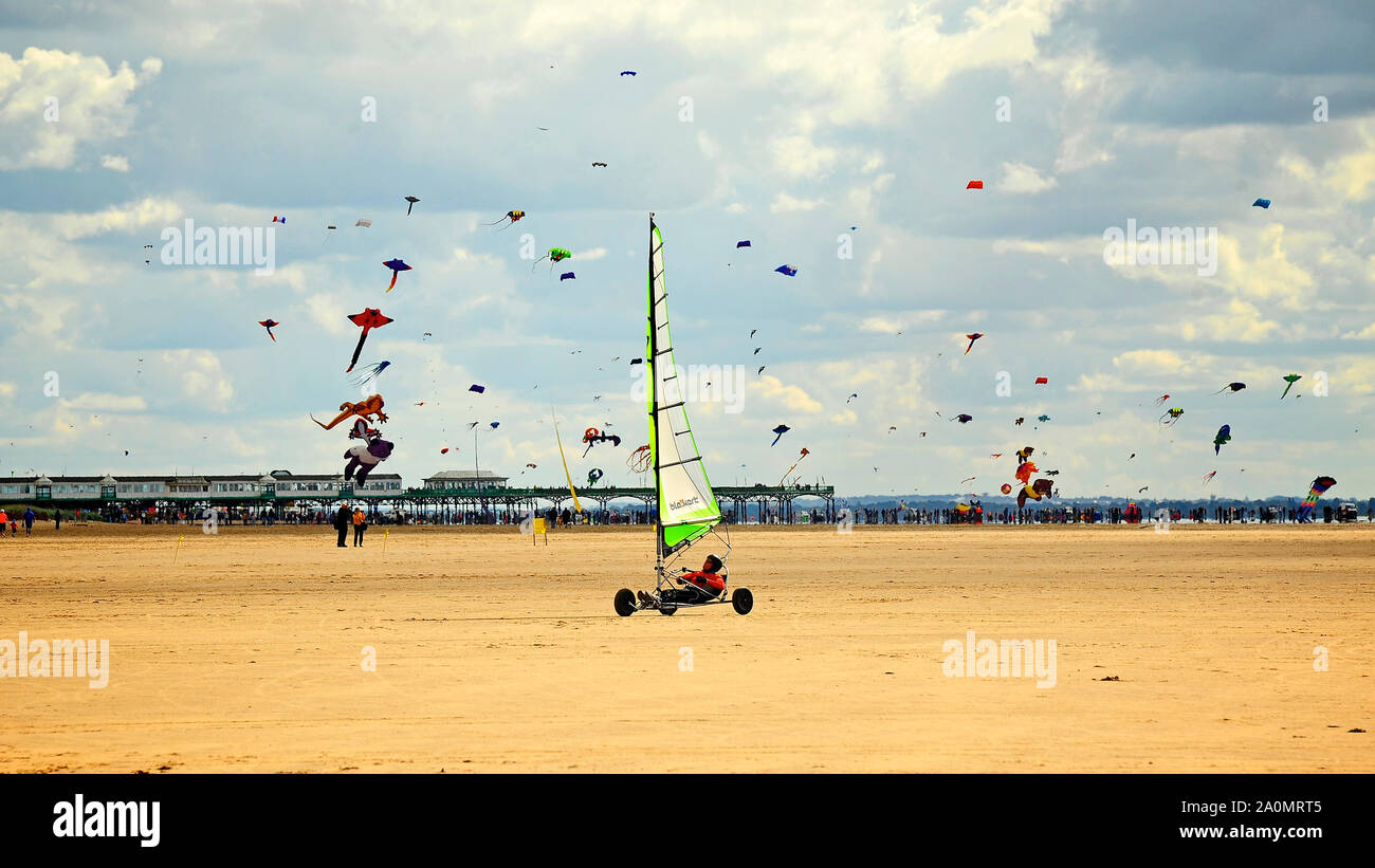 Sand Racing Kite Sand yachting against a background of the St Annes International Kite ...