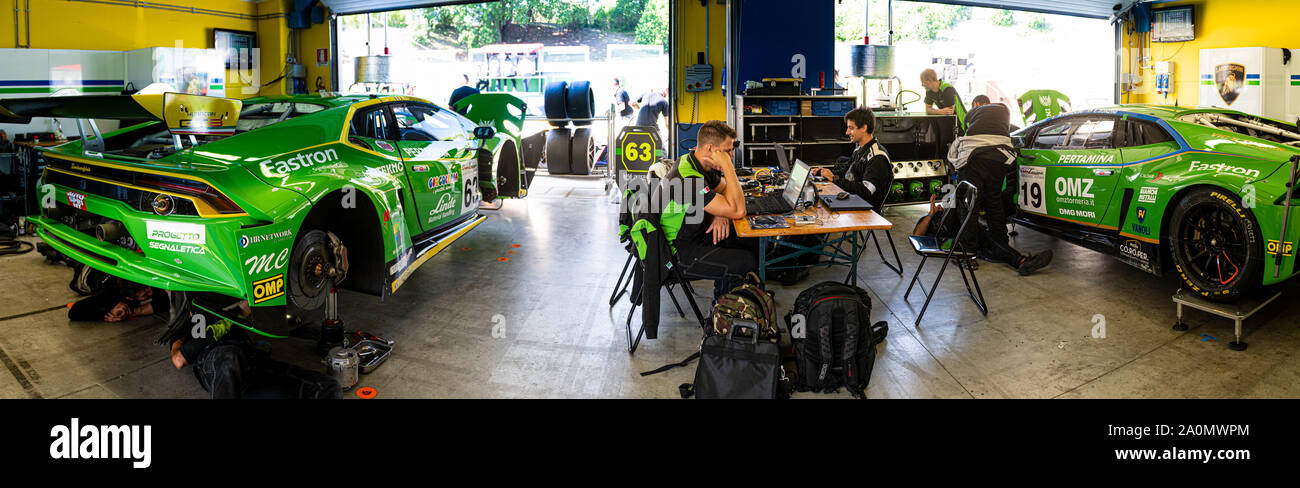 Vallelunga, Italy september 14 2019. Wide panoramic view of Lamborghini Huracan team paddock with mechanics at work with computer technology for fine Stock Photo