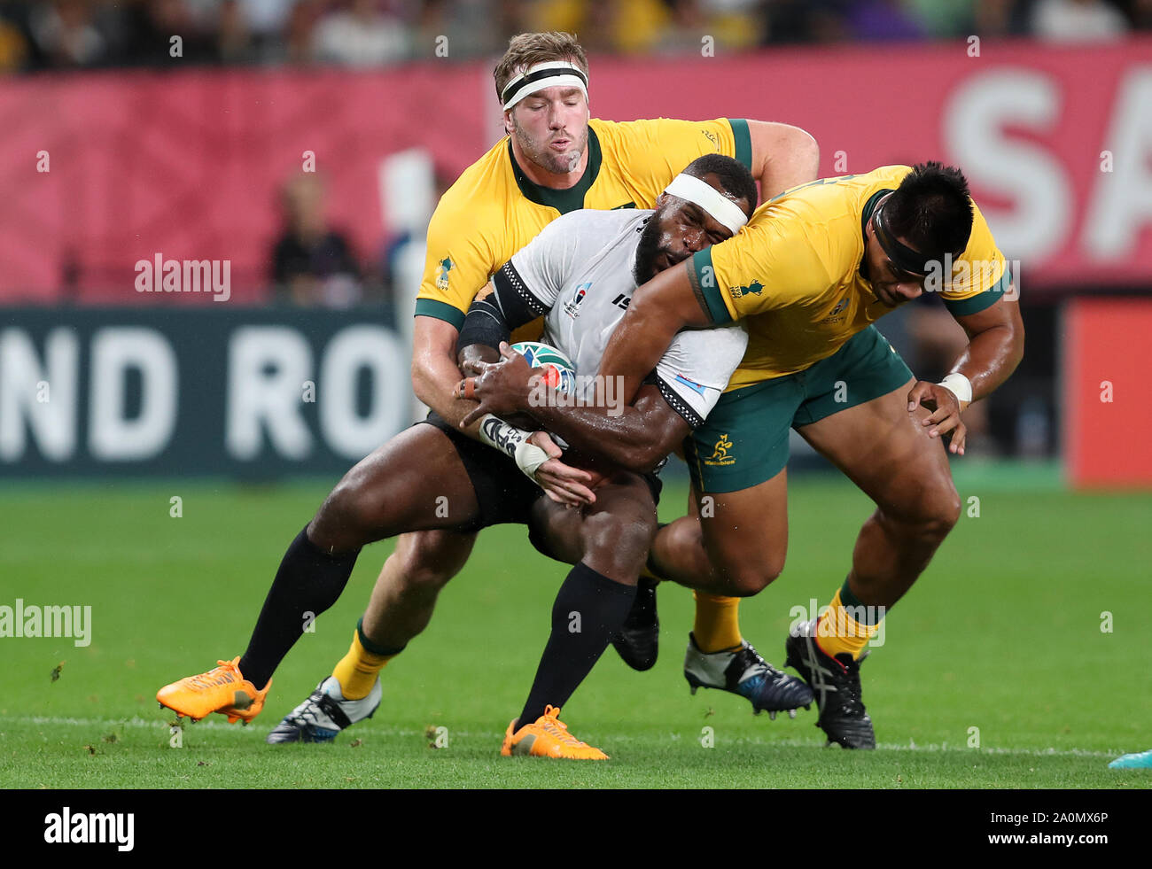Fiji's Levani Botia is tackled by Australia's Izack Rodda and Allan Alaalatoa during the 2019 Rugby World Cup Pool D match at Sapporo Dome. Stock Photo
