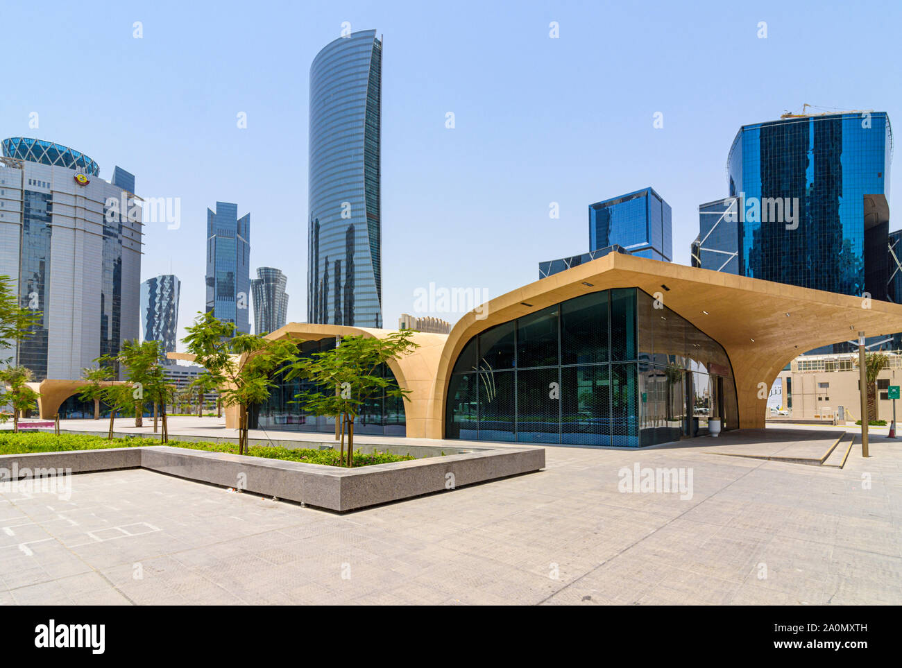 DECC Doha Metro station entrance looking towards the skyscrapers of the West Bay area, Doha, Qatar Stock Photo