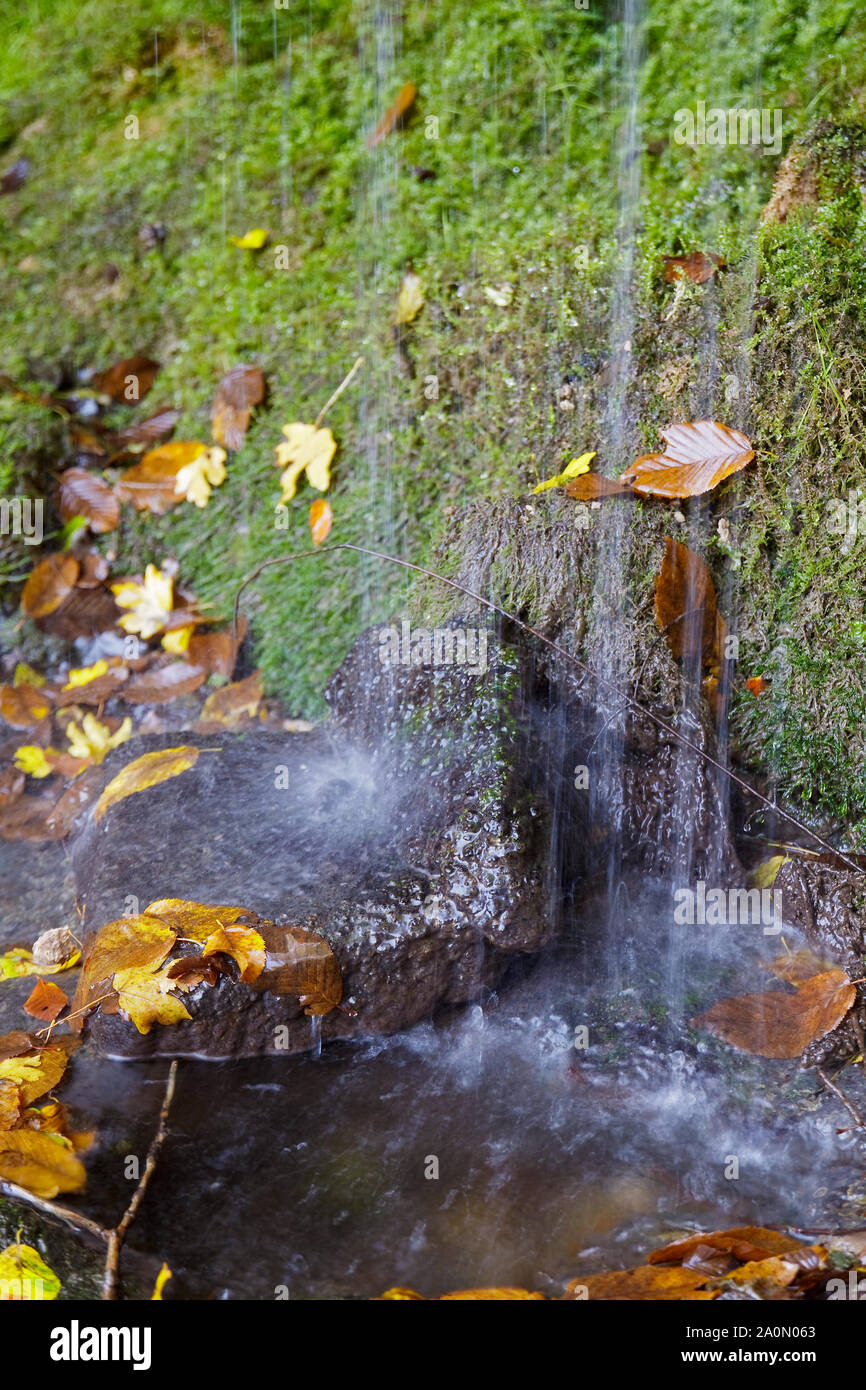 Detail of the waterway of a mountain waterfall, breathtaking.Selective focus with shallow depth of field. Stock Photo