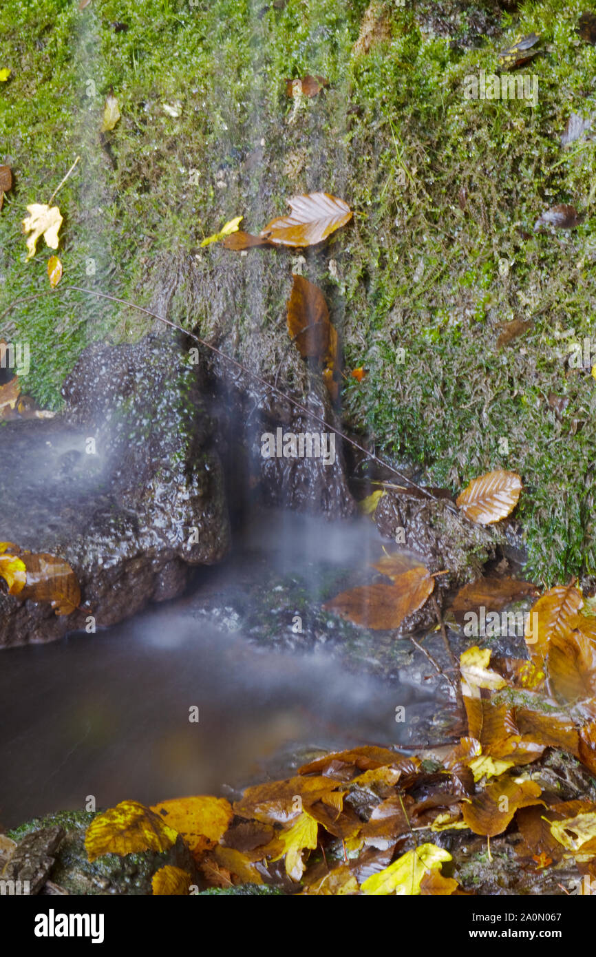 Detail of the waterway of a mountain waterfall, breathtaking.Selective focus with shallow depth of field. Stock Photo