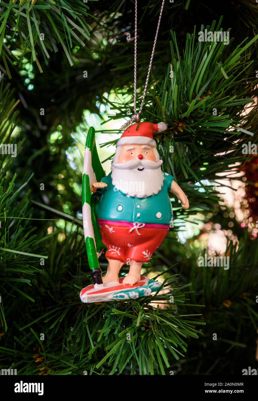 Australian Father Christmas decoration hanging on a Christmas tree in Australia Stock Photo