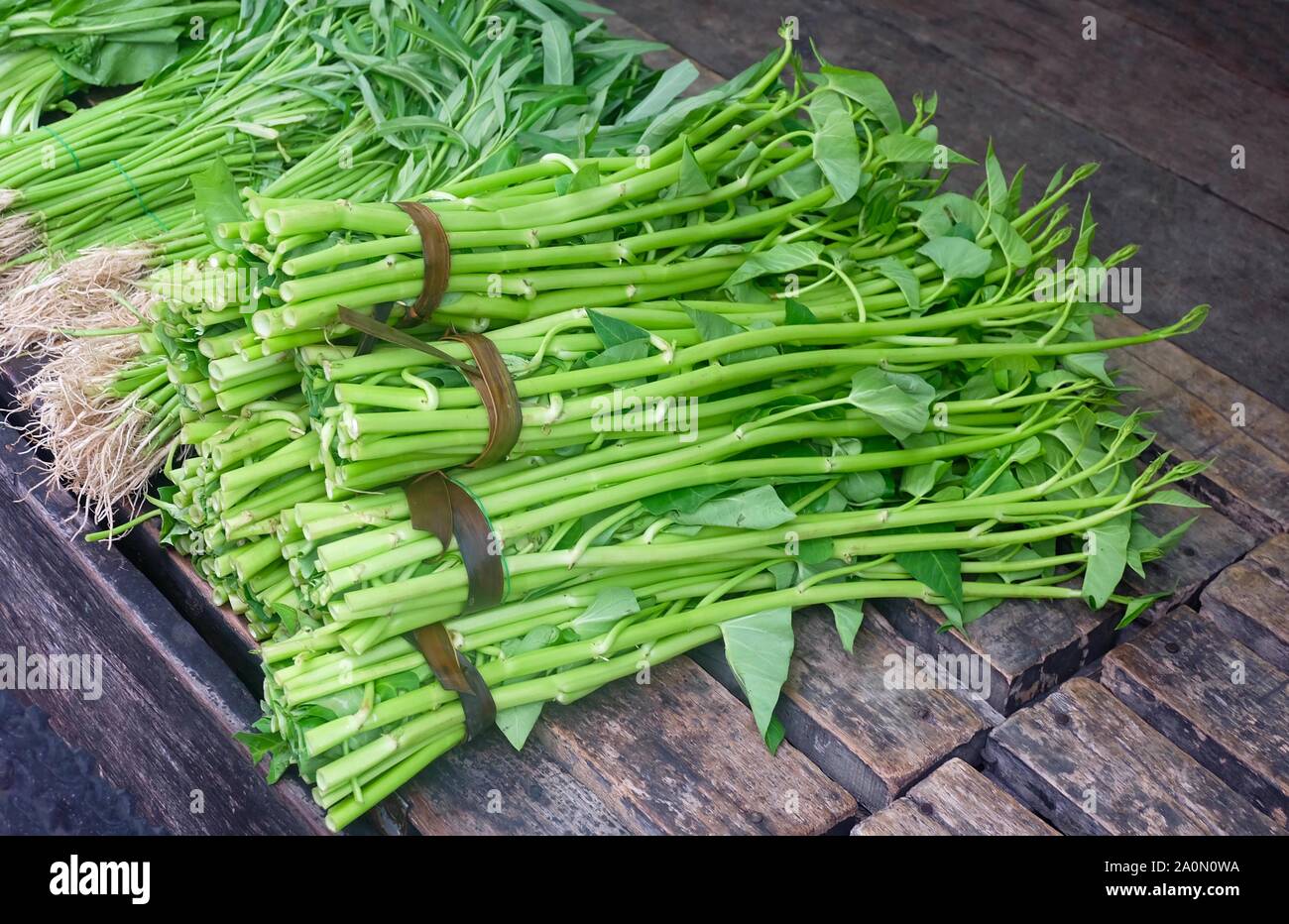 Vegetable and Herb, Pile of Water Spinach or Ipomoea Aquatica Selling at Fresh Market. Stock Photo