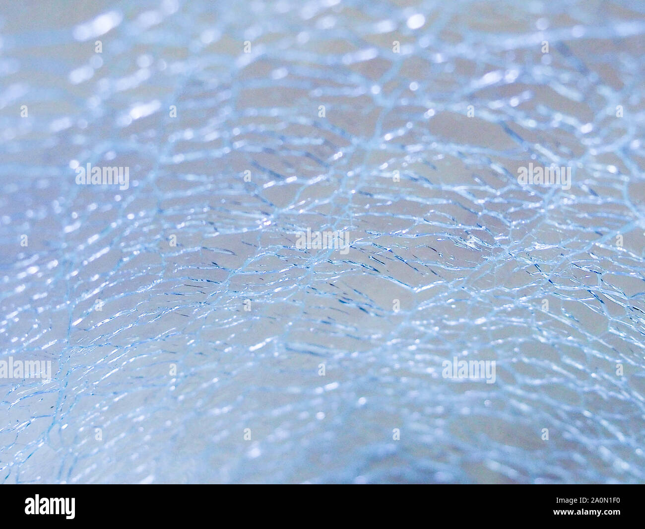 Abstract - Cracked Glass, texture small cracks on the glass Stock Photo