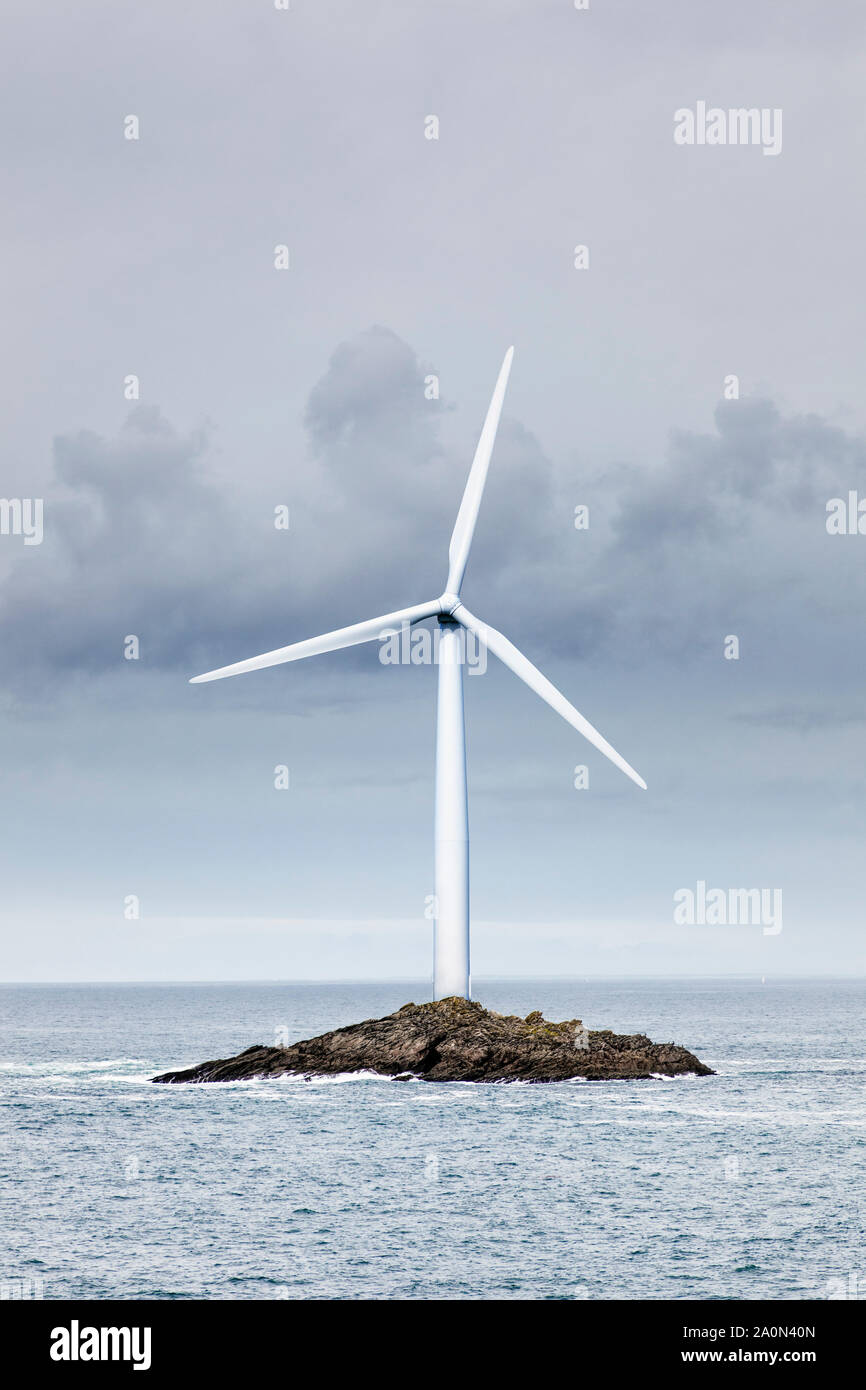 Wind turbine on a small island – offshore energy concept Stock Photo