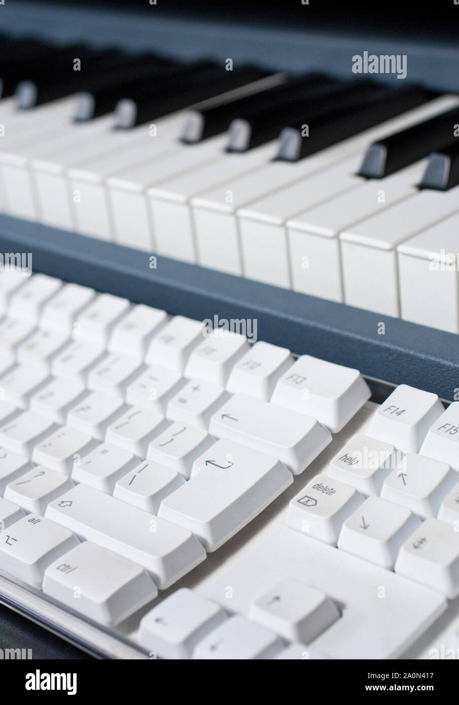 Music keyboard and computer keyboard used for composing in the digital age Stock Photo