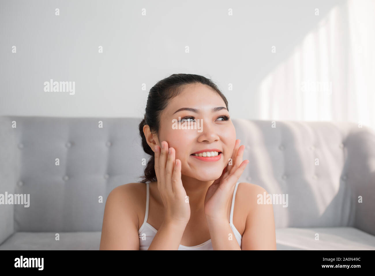 Felling clean and fresh. Skin care,Beauty treatment and spa concept.  Skin touch own face with closed eye Stock Photo