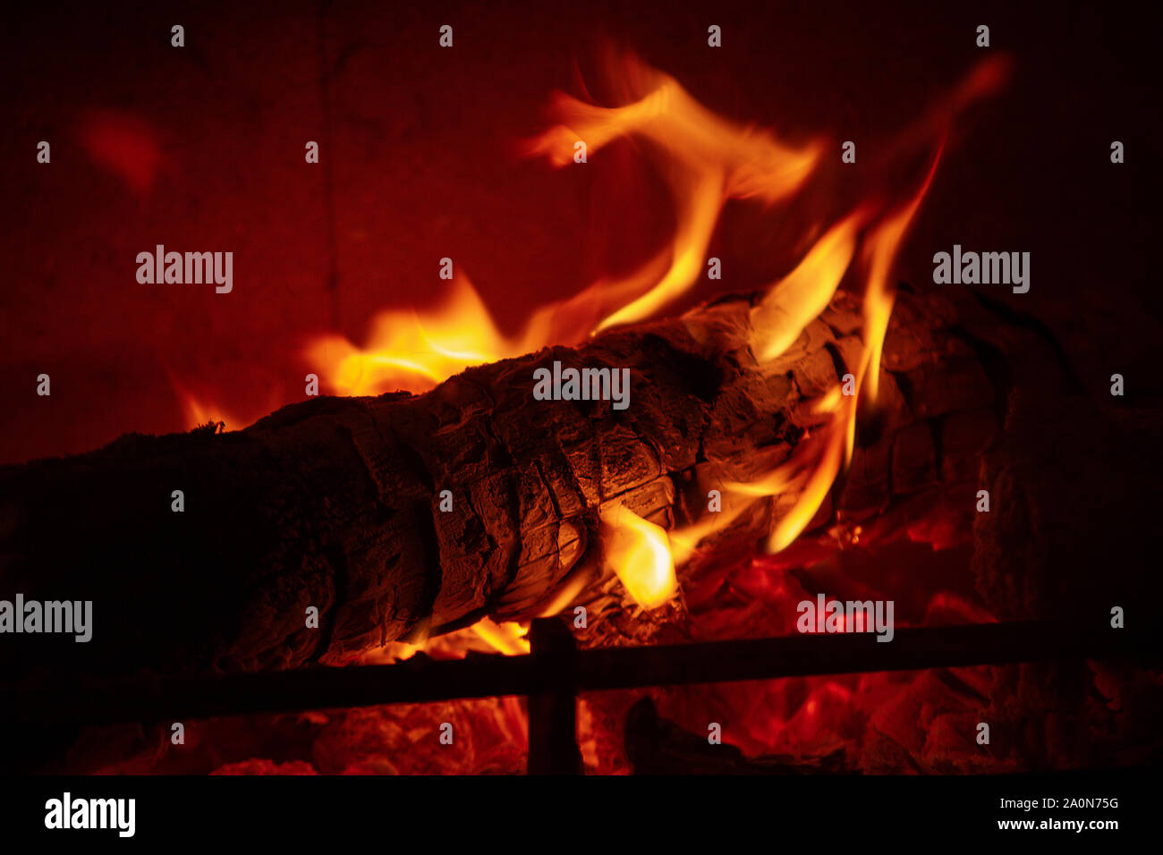 Natural fireplace burning wallpaper. Stock Photo