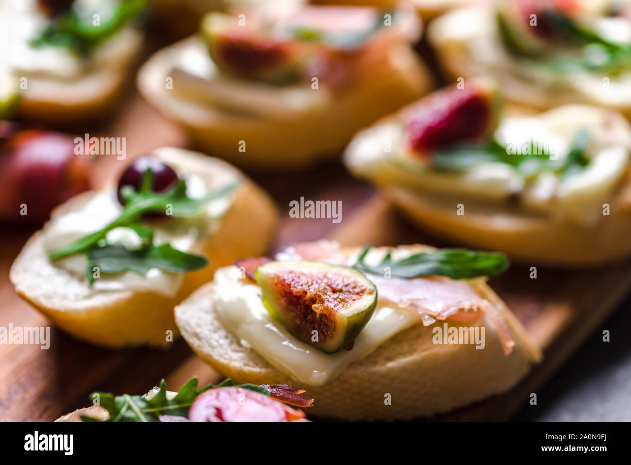 Traditional tapas from spain or italian bruschetta with cheese, meat