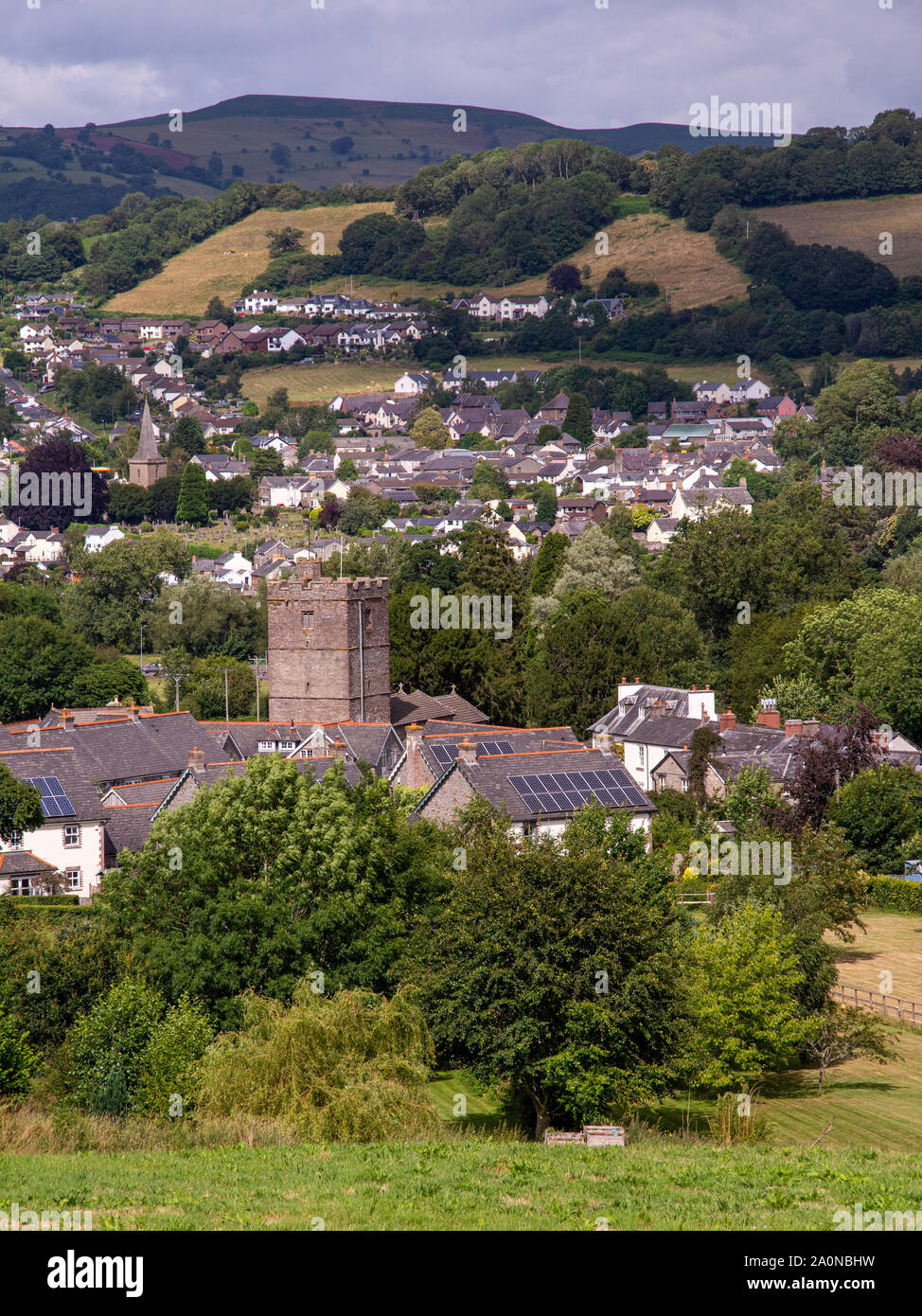 Crickhowell, Wales, UK - July 18, 2019: Sun shines on the villages of Llangattock and Crickhowell in the Usk Valley under the Black Mountains of South Stock Photo