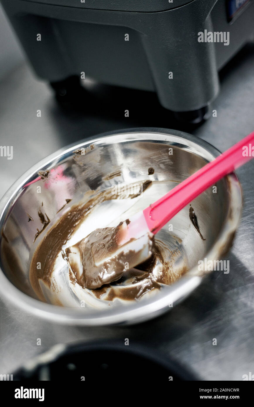 making gelato ice cream with modern professional equipment preparation
