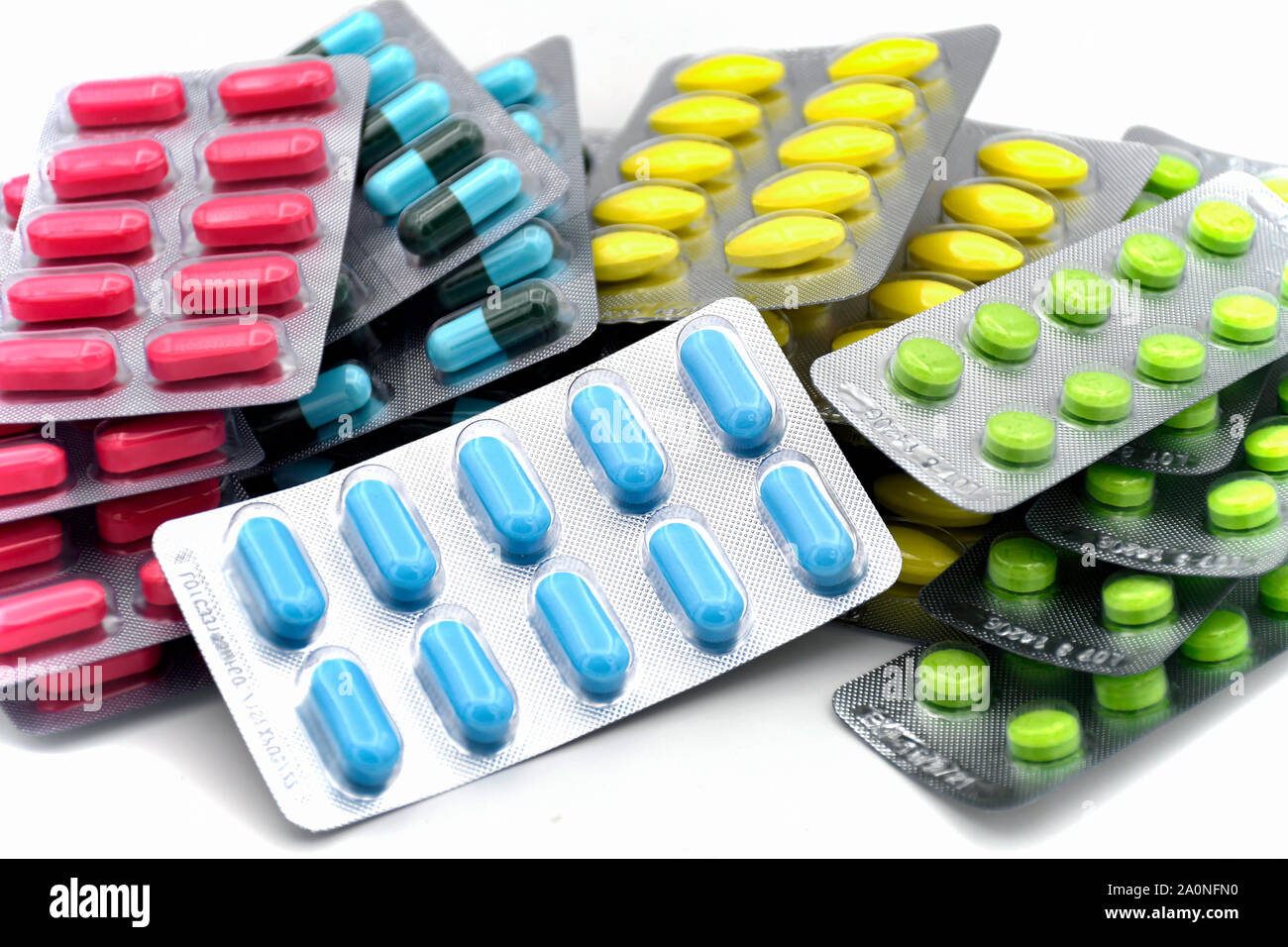Oral dosage form. Capsule, tablet, caplet in strip for unit dose dispensing. Colorful oral medicine dosage form in strips. Stock Photo