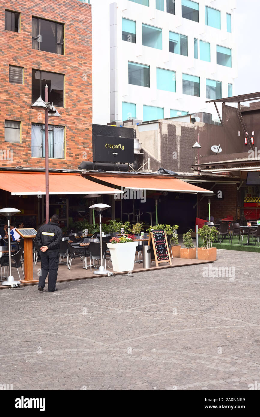 QUITO, ECUADOR - AUGUST 6, 2014: Outdoor sitting area of the Coffee Bar and the Dragonfly restaurant-cocktail room next to it on Plaza Foch in Quito Stock Photo