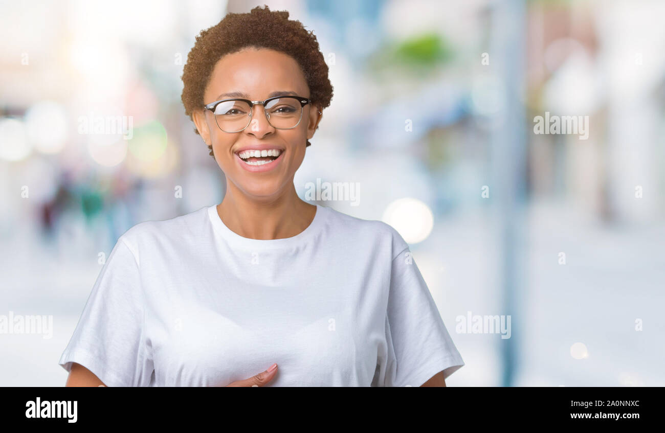 Beautiful young african american woman wearing glasses over isolated ...