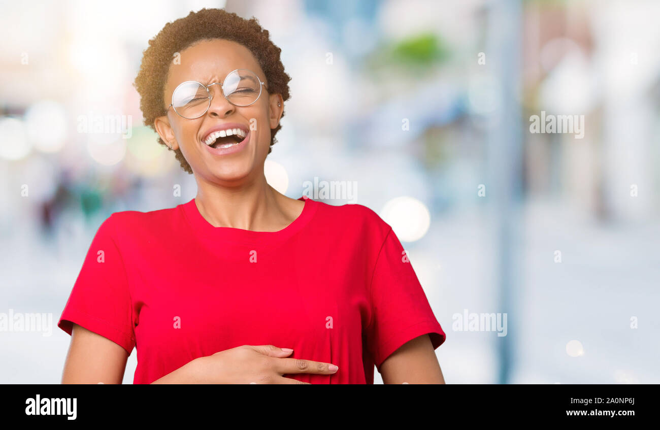 Beautiful young african american woman wearing glasses over isolated ...