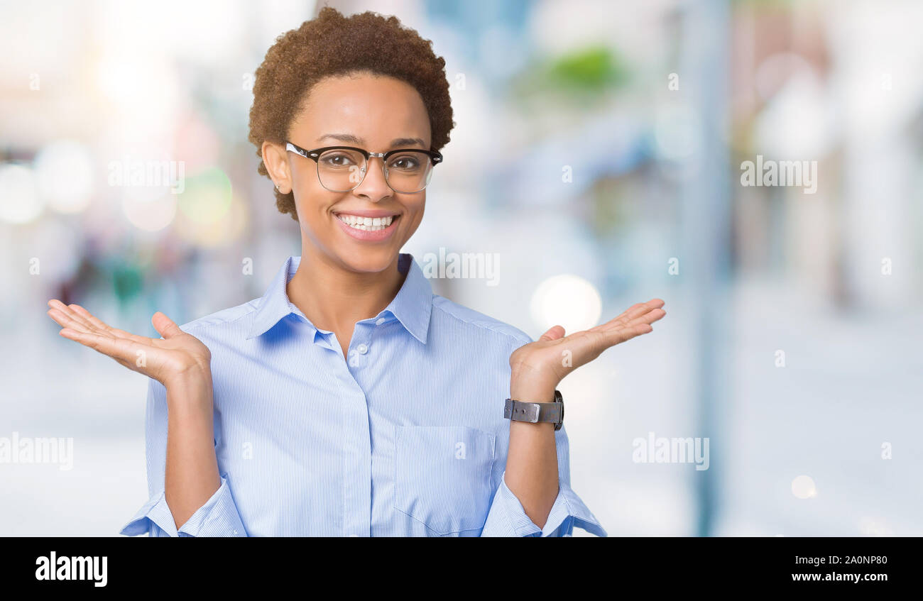 Young beautiful african american business woman over isolated ...
