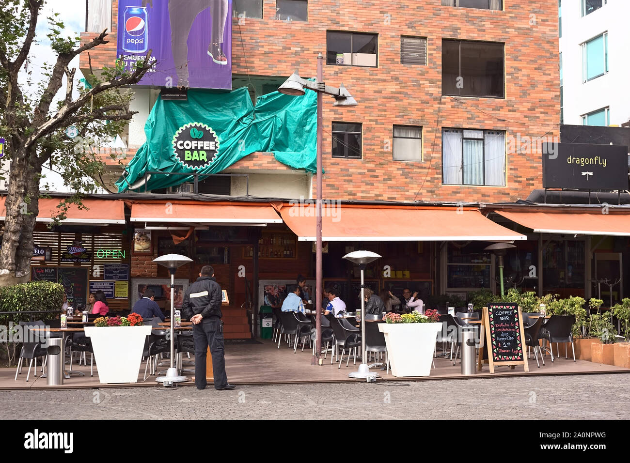 QUITO, ECUADOR - AUGUST 6, 2014: Outdoor sitting area of the Coffee Bar restaurant on Plaza Foch in the tourist district La Mariscal in Quito, Ecuador Stock Photo