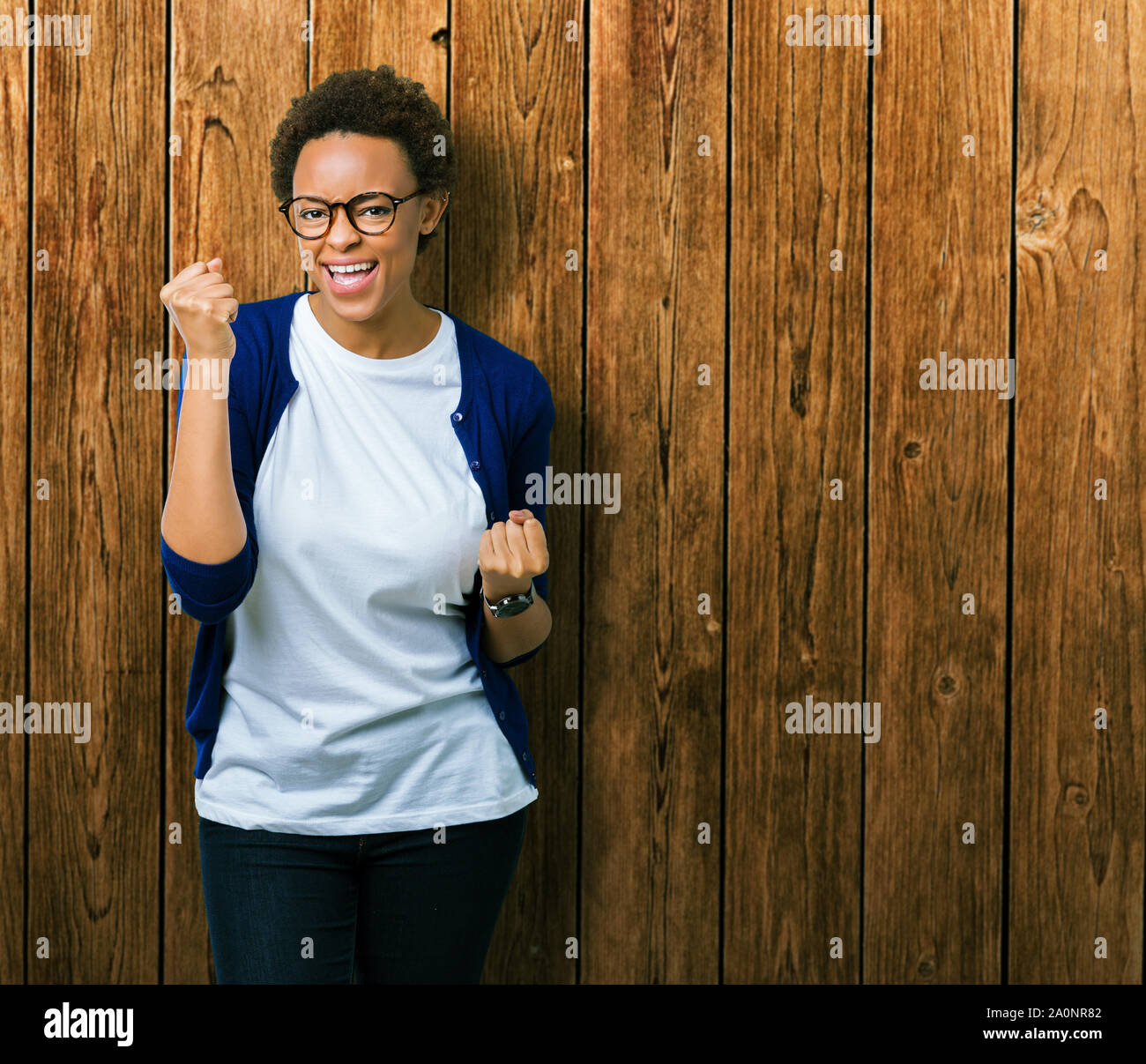 Young beautiful african american woman wearing glasses over isolated ...