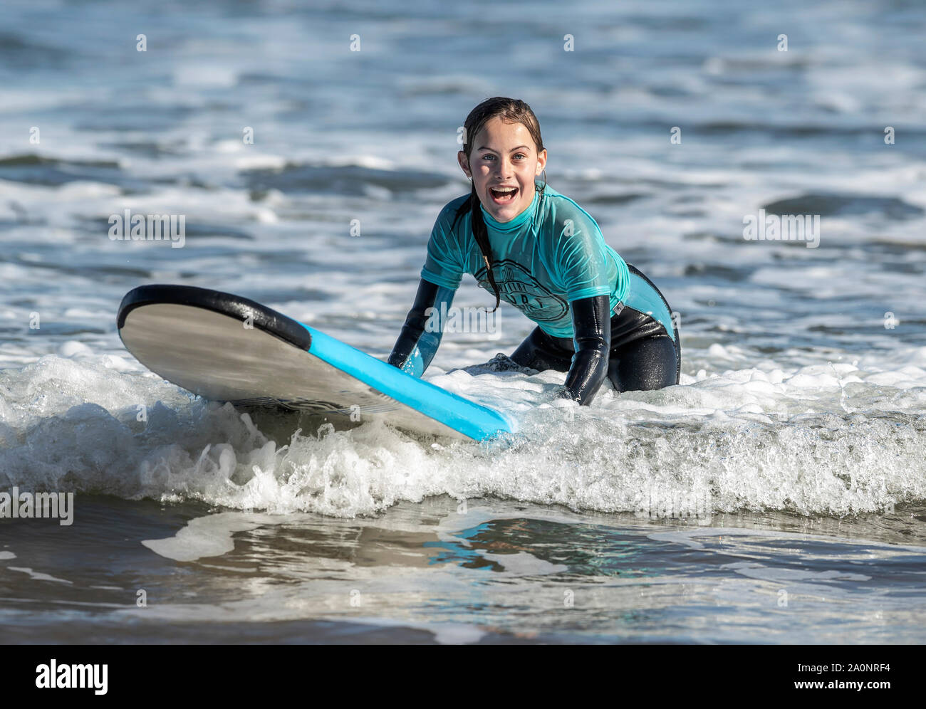 Lily Owen during a surfing lesson on Whitby beach in Yorkshire, as