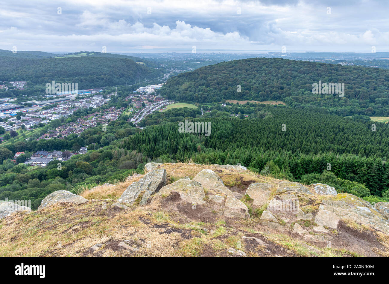 The cityscape of Cardiff is laid out below The Garth Mountain at Taff's Well at dusk. Stock Photo