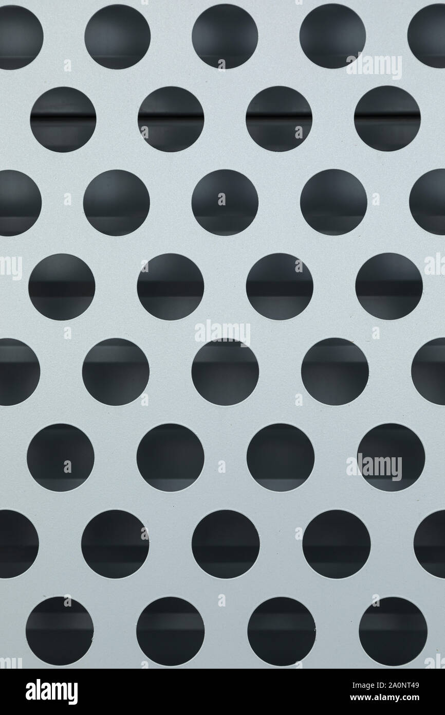 Close-up of white surface with big black round dots Stock Photo - Alamy
