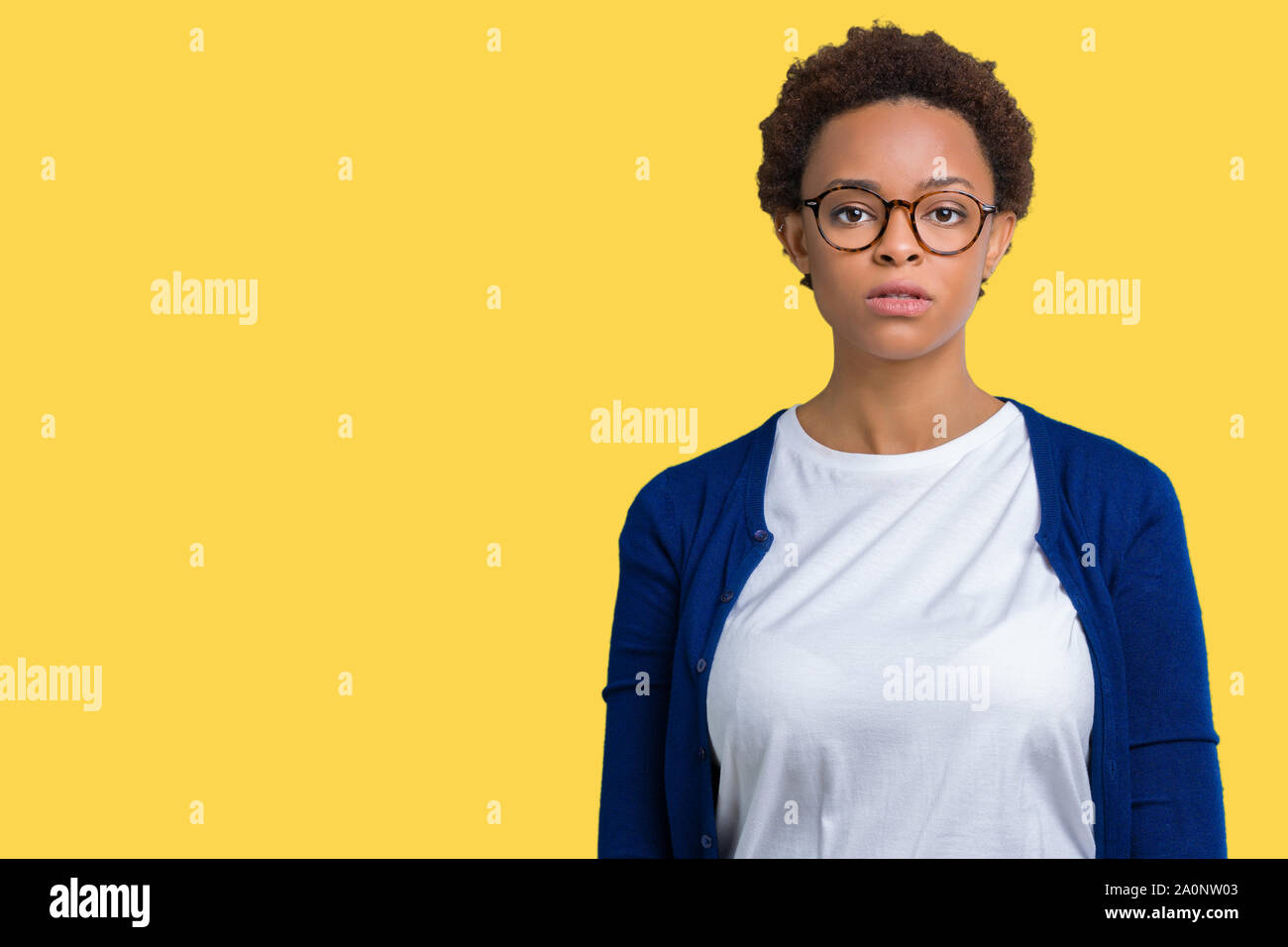 Young beautiful african american woman wearing glasses over isolated ...