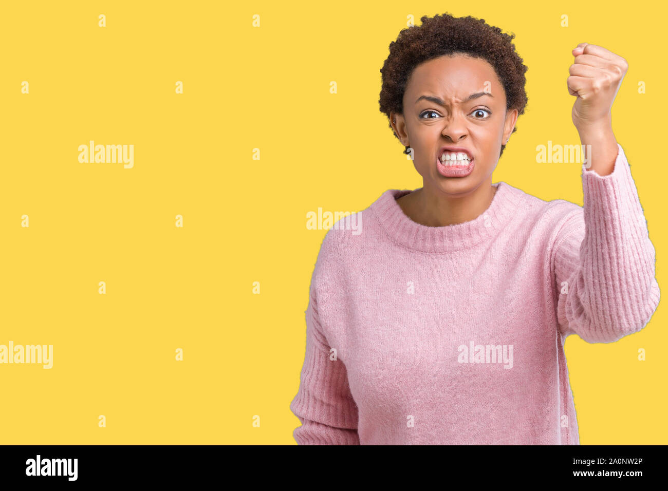 Beautiful young african american woman over isolated background angry ...