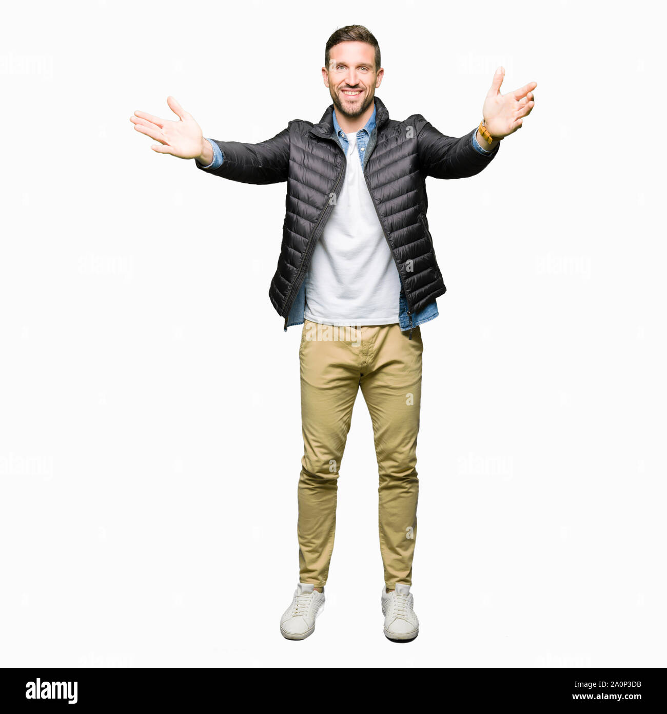 Handsome Man Wearing Winter Coat Looking At The Camera Smiling With Open Arms For Hug Cheerful Expression Embracing Happiness Stock Photo Alamy