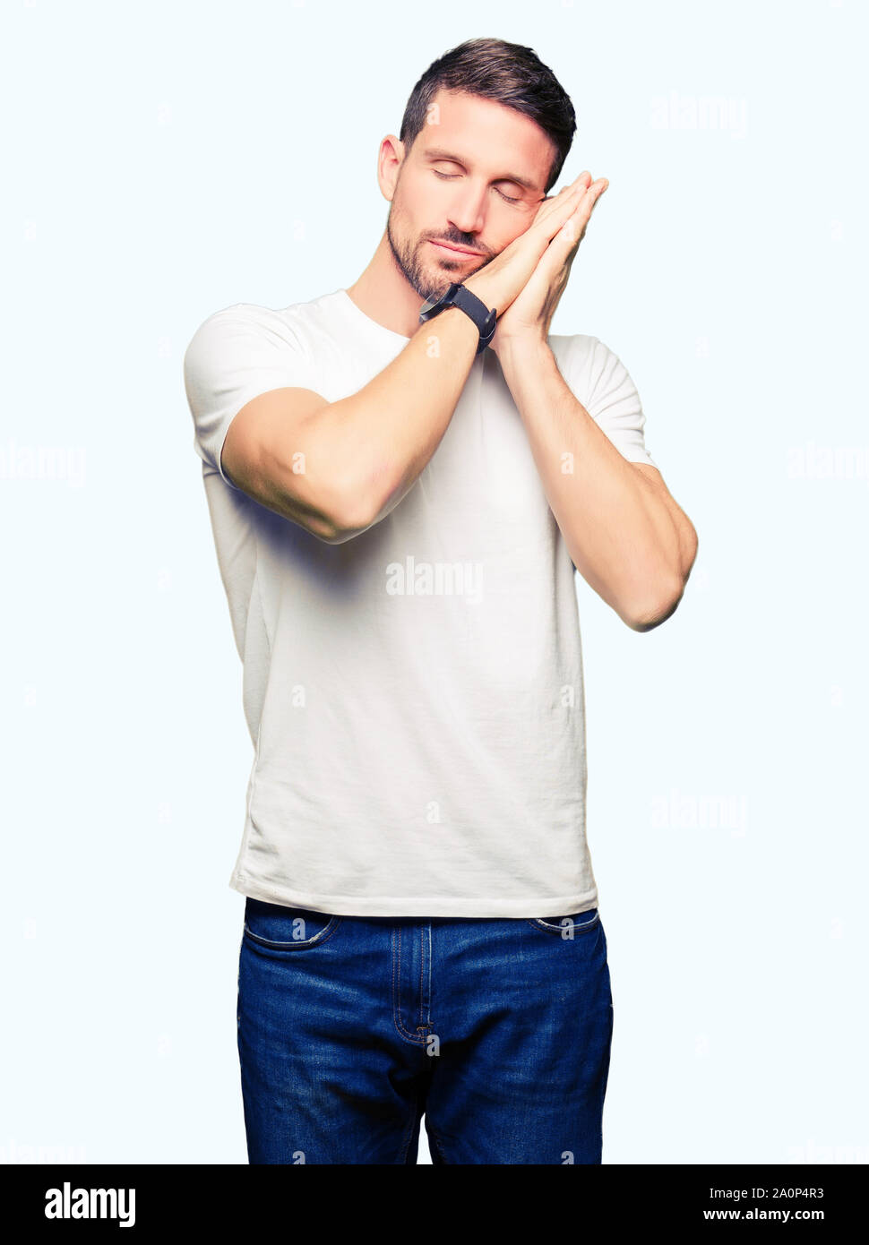 Handsome man wearing casual white t-shirt sleeping tired dreaming and ...