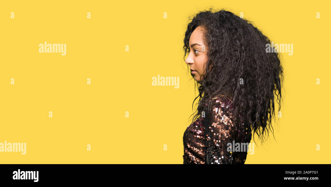 Young Beautiful Girl With Curly Hair Wearing Night Party Dress