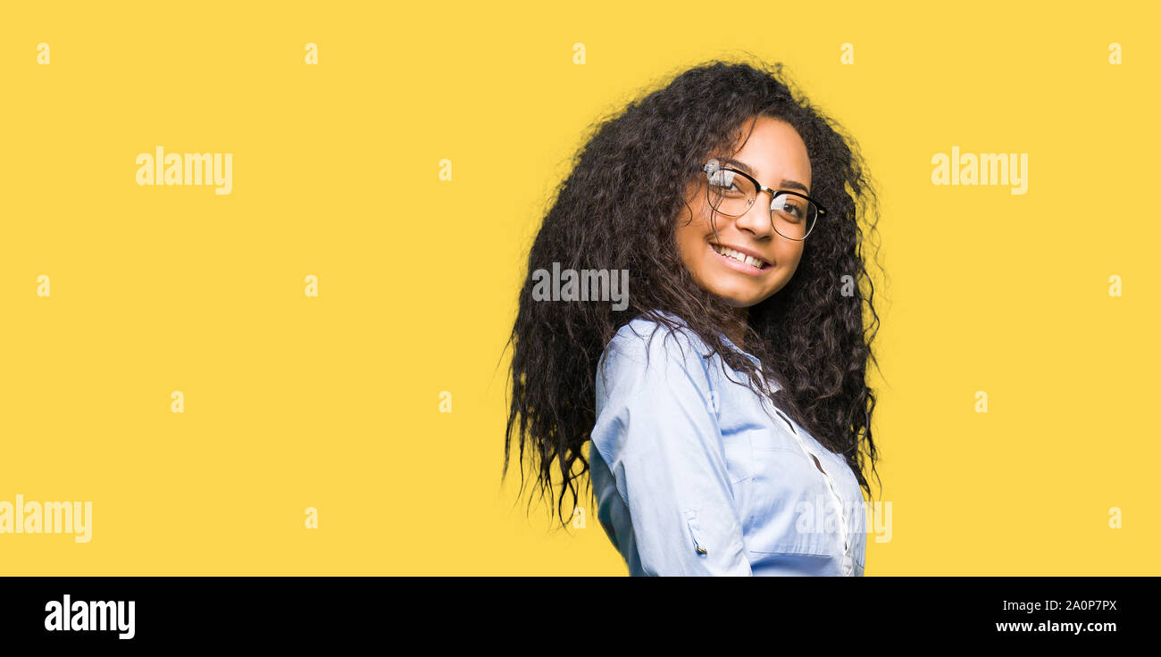 Young Beautiful Business Girl With Curly Hair Wearing Glasses