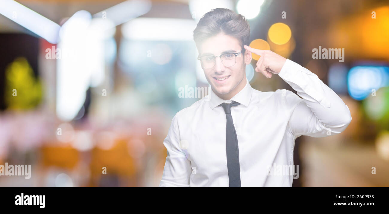 Young business man wearing glasses over isolated background Smiling ...