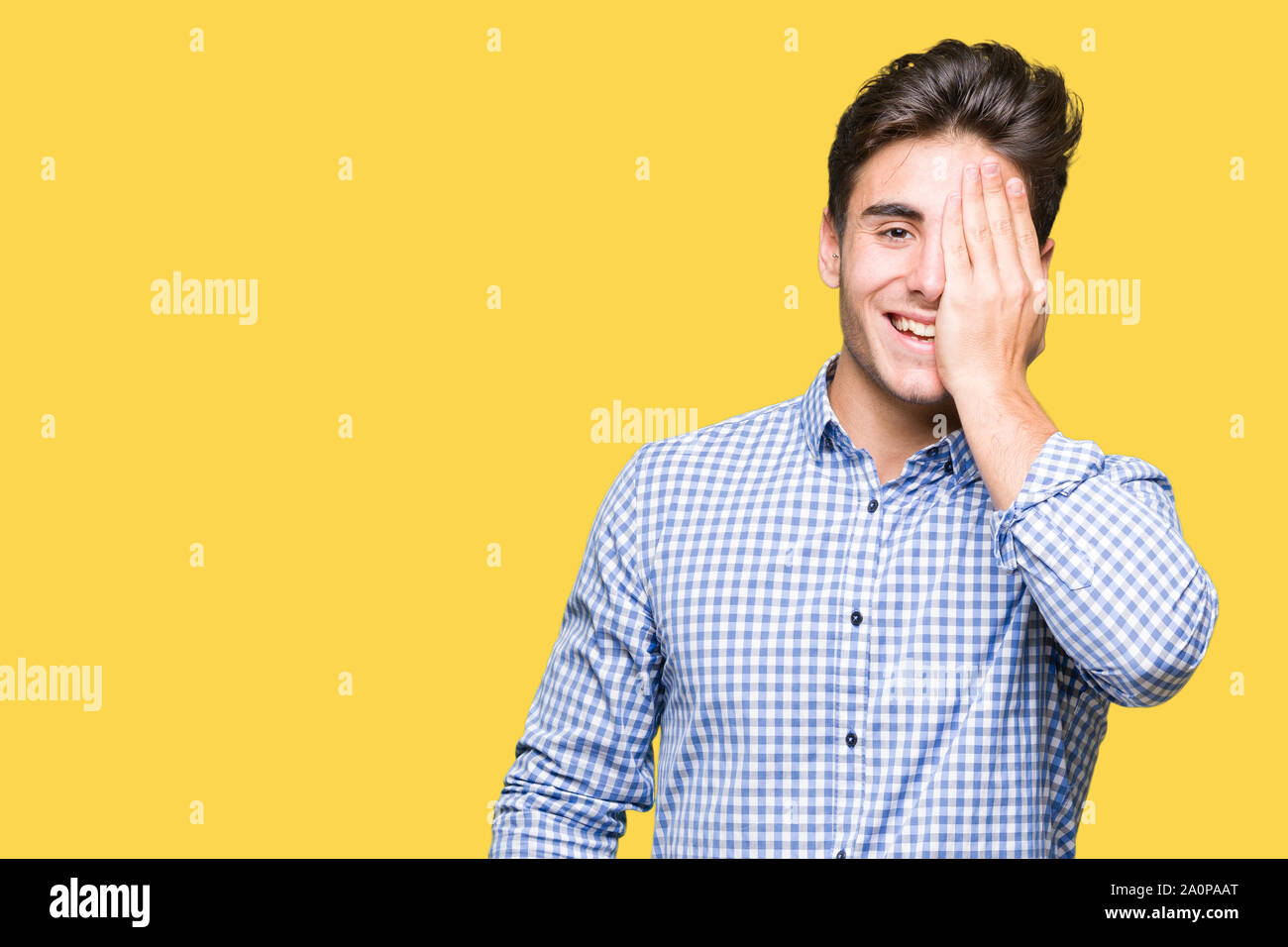 Young handsome business man over isolated background covering one eye ...