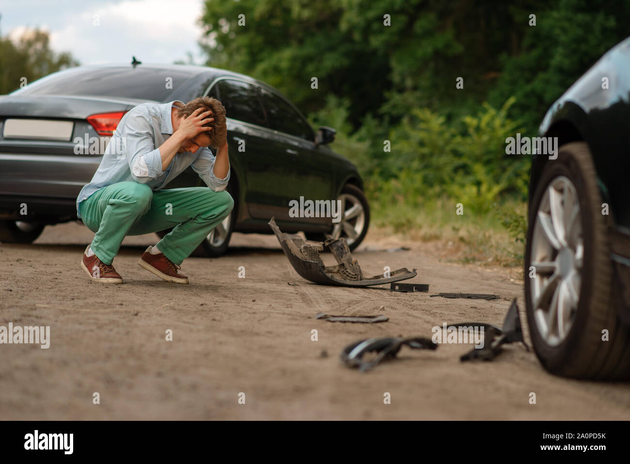 Upset male drivers after car accident on road Stock Photo - Alamy