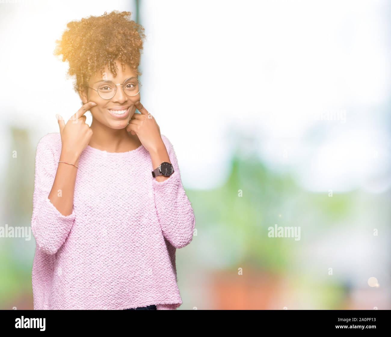 Beautiful young african american woman wearing glasses over isolated ...