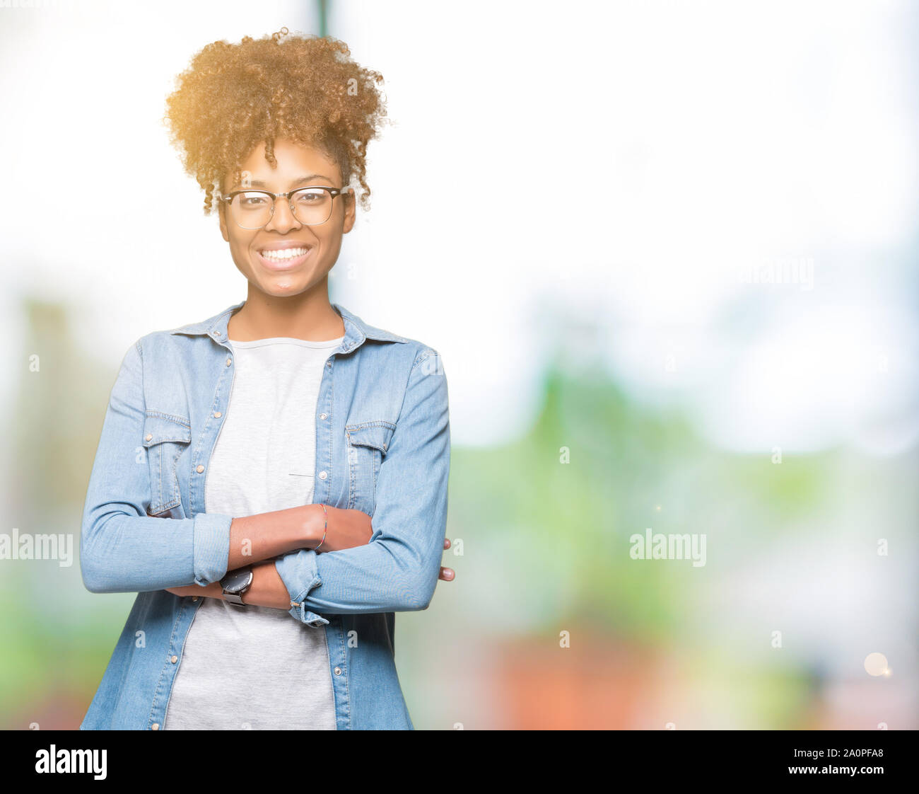 Beautiful young african american woman wearing glasses over isolated ...