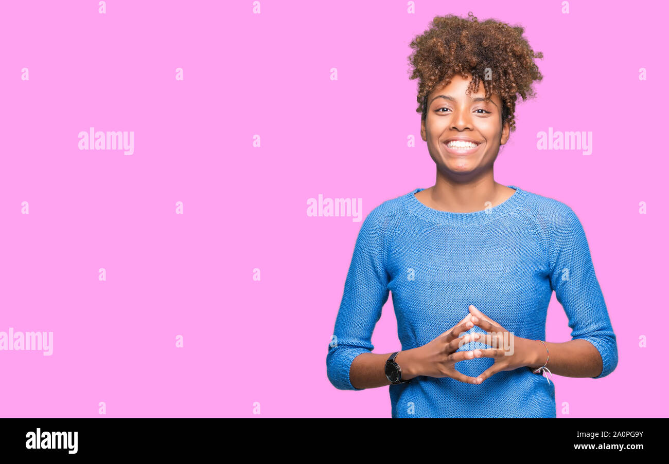 Beautiful young african american woman over isolated background Hands ...
