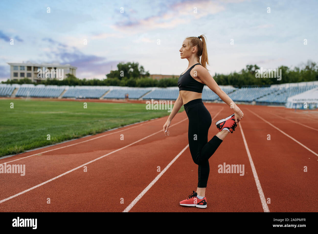 Female jogger in sportswear, workout on stadium Stock Photo Alamy