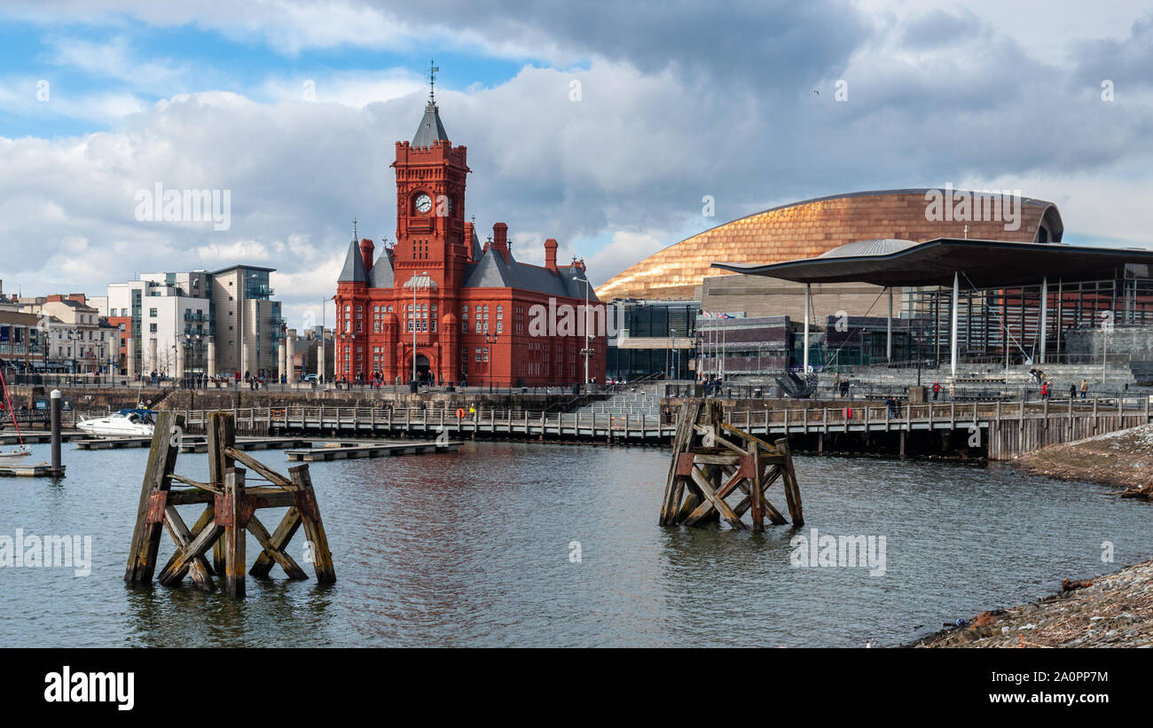 Cardiff, Wales, UK - March 17, 2013: The Welsh National Assembly Building and Pierhead Building are among prominent landmarks in the Cardiff Bay neigh Stock Photo