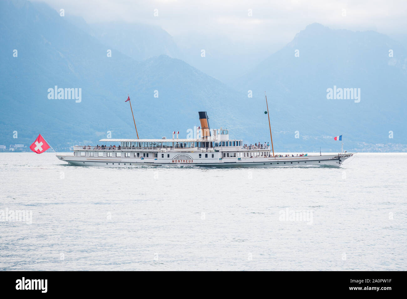 Tourists onboard the oldest Belle Epoque steam paddle boat Montreux enjoying cruising on Lake Geneva (Lac Leman) between Switzerland and France Stock Photo
