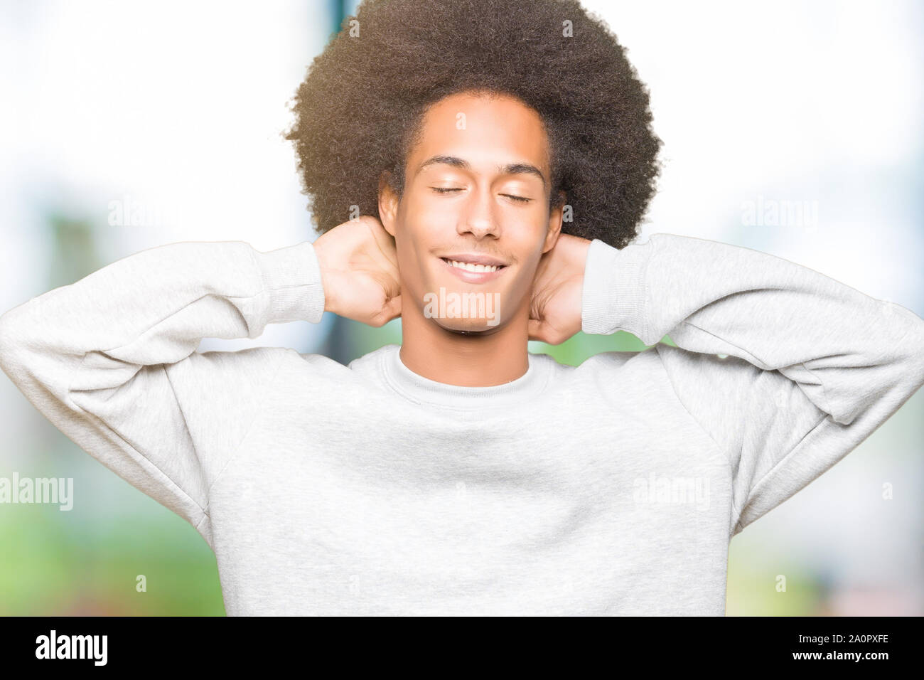 Young African American Man With Afro Hair Wearing Sporty